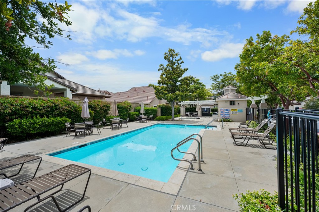 2095 Tulip Avenue Simi Valley, CA 93063 - Photo 33 of 39 a view of a swimming pool with chairs