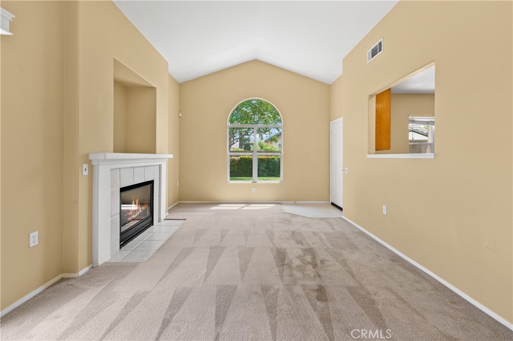 2095 Tulip Avenue Simi Valley, CA 93063 - Photo 6 of 39 a view of an empty room with a window and fireplace