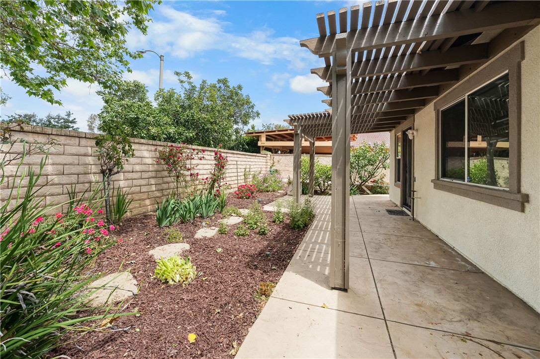 2095 Tulip Avenue Simi Valley, CA 93063 - Photo 8 of 39 a view of a pathway with a tree in front of house