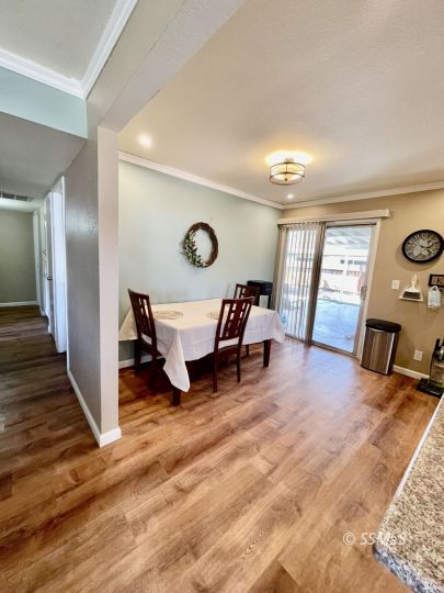 401 South Lincoln Street Ridgecrest, CA 93555 - Photo 5 of 27 a living room with furniture and a wooden floor
