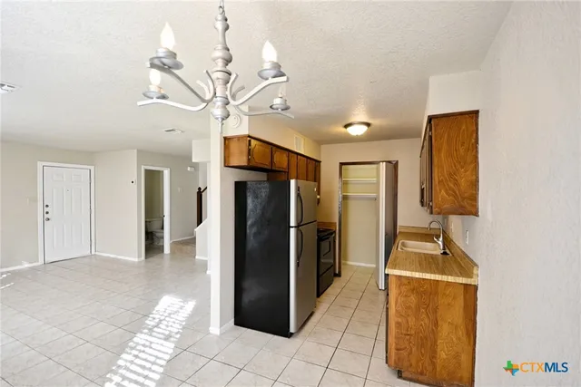 a view of a hallway with a living room