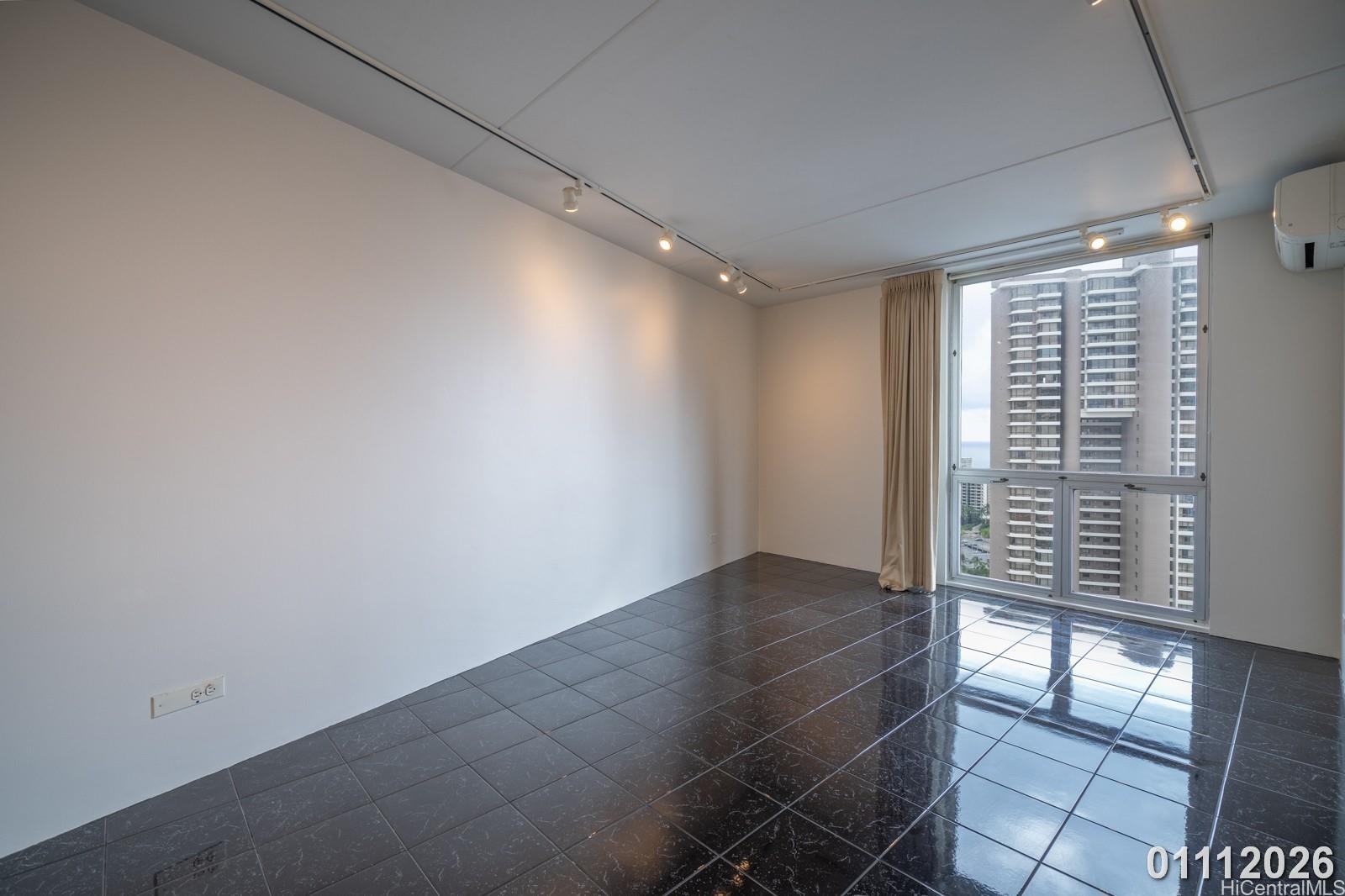 469 Ena Road, Unit 2903 Honolulu, HI 96815 - Photo 19 of 25 a view of an empty room with a window