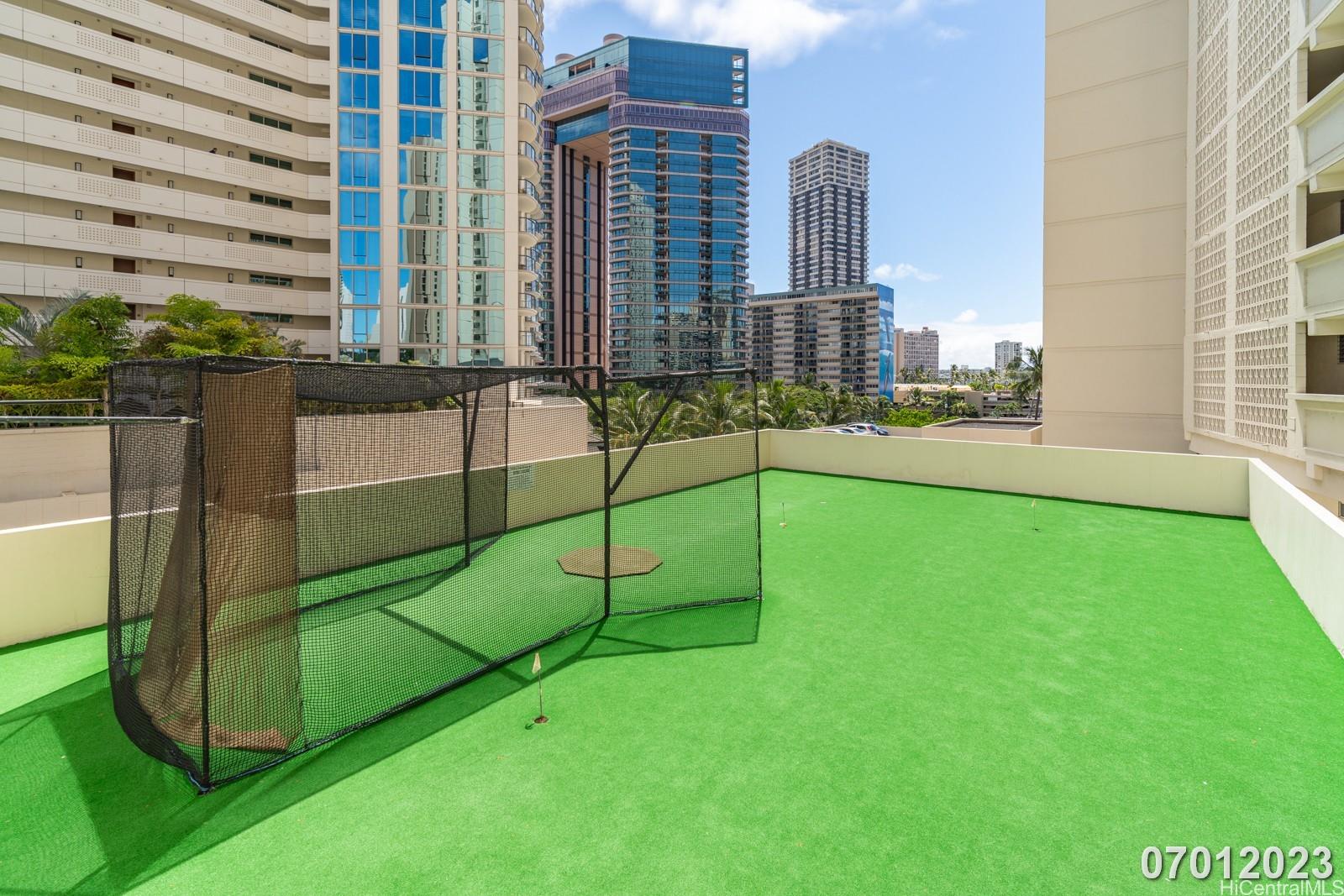 469 Ena Road, Unit 2903 Honolulu, HI 96815 - Photo 22 of 25 a view of a tennis court