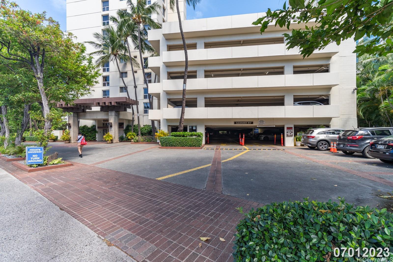 469 Ena Road, Unit 2903 Honolulu, HI 96815 - Photo 25 of 25 a view of building with cars parked