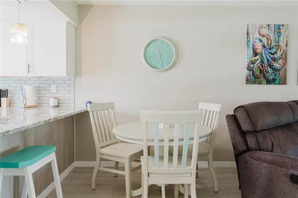 a kitchen with a stove and a refrigerator