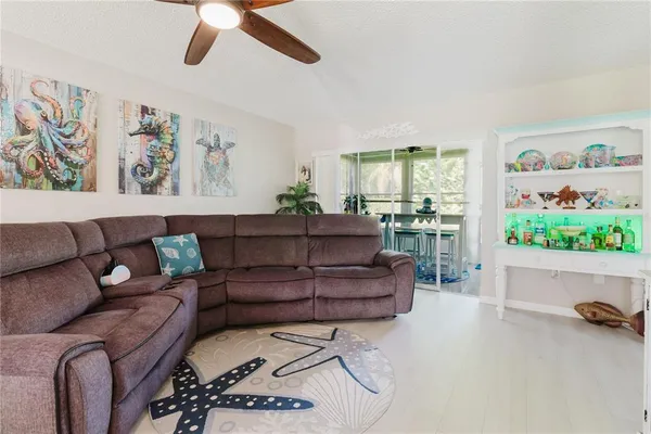 a bedroom with a bed and painting on the wall