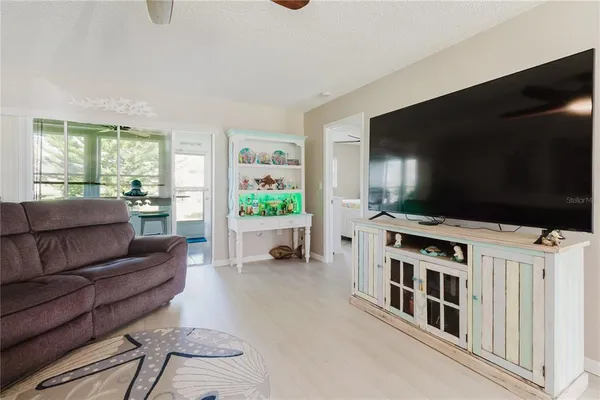 a bed room with a bed and a fish tank