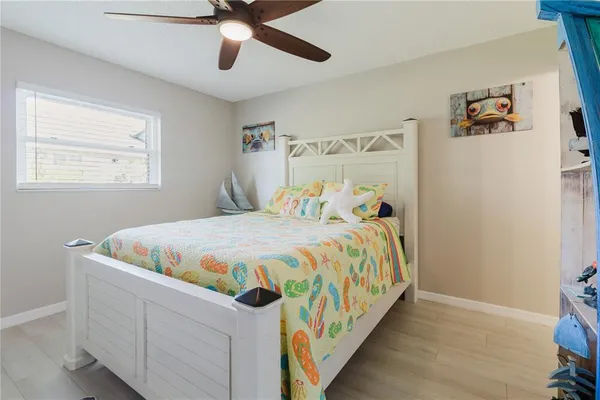 a white toilet sitting next to a shower