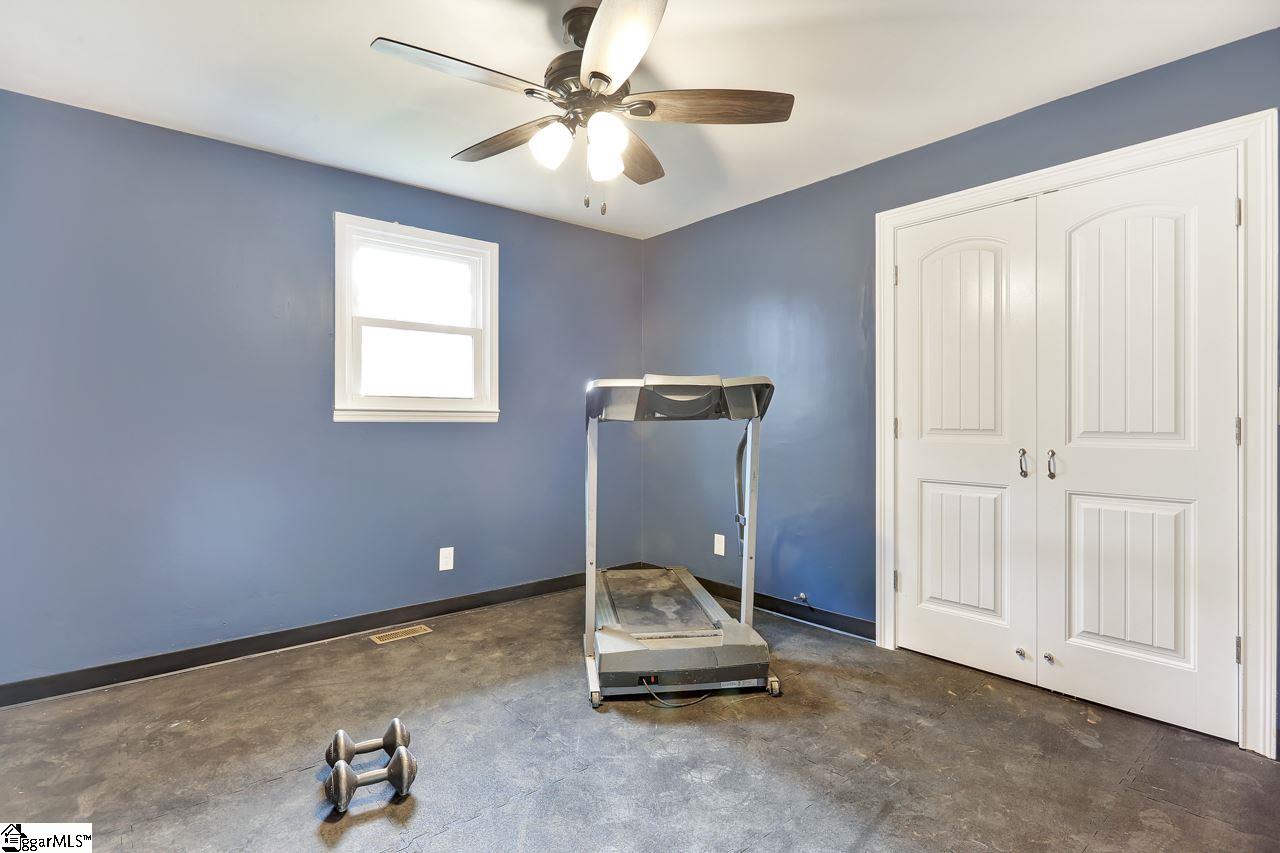 4916 State Park Road Travelers Rest, SC 29690 - Photo 20 of 34 Private, dedicated exercise room with closet to store gear, located right outside master suite for easy access