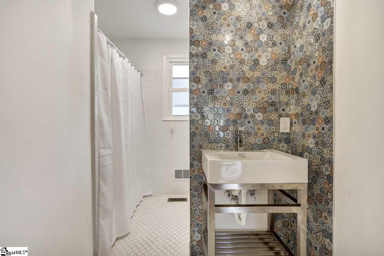 4916 State Park Road Travelers Rest, SC 29690 - Photo 24 of 34 Fantastically designed hall bath with a tub/shower