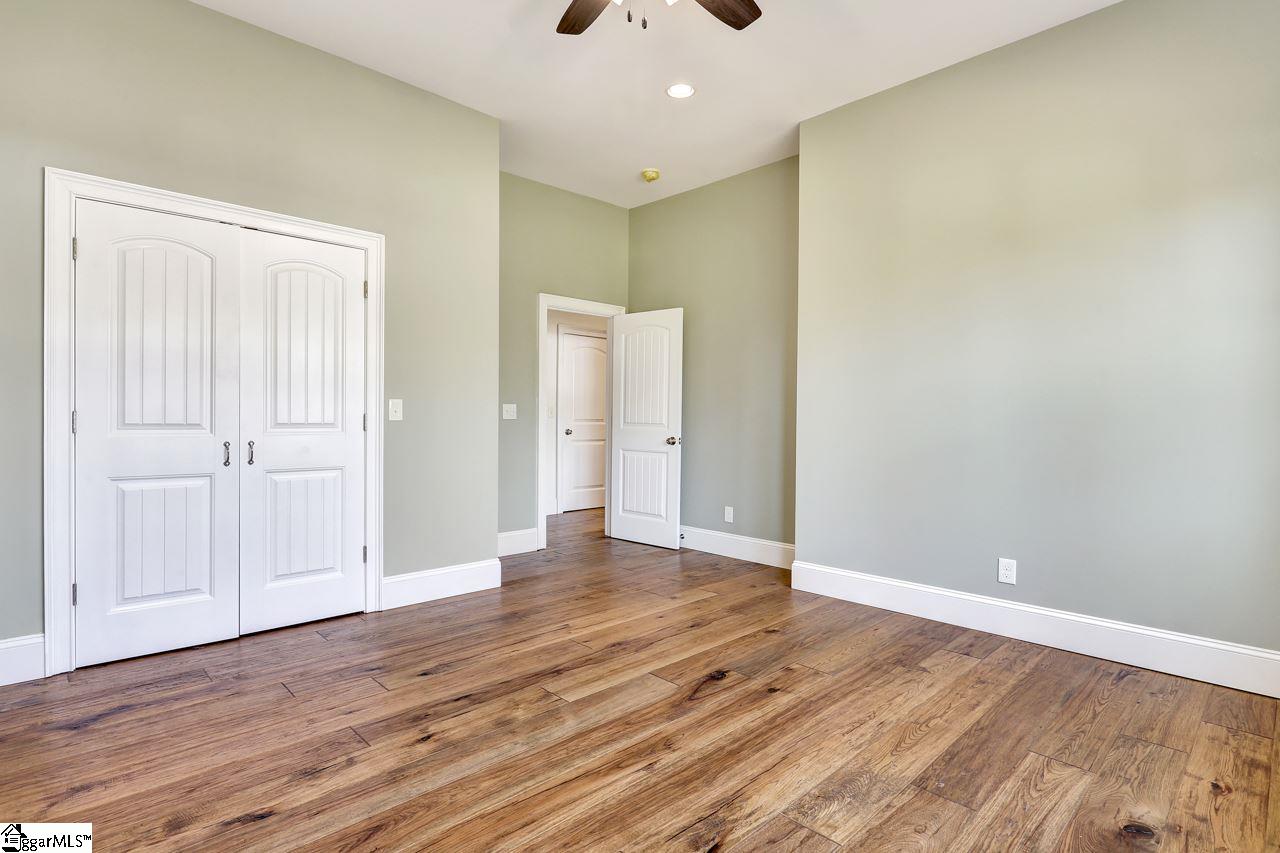 4916 State Park Road Travelers Rest, SC 29690 - Photo 28 of 34 Two large upstairs bedroom with a bathroom and work area can be used so many ways. It can serve as kids rooms with a nook for undisturbed school work. It can be a multiple generation residence or just an upstairs guest area for visitors. So many options