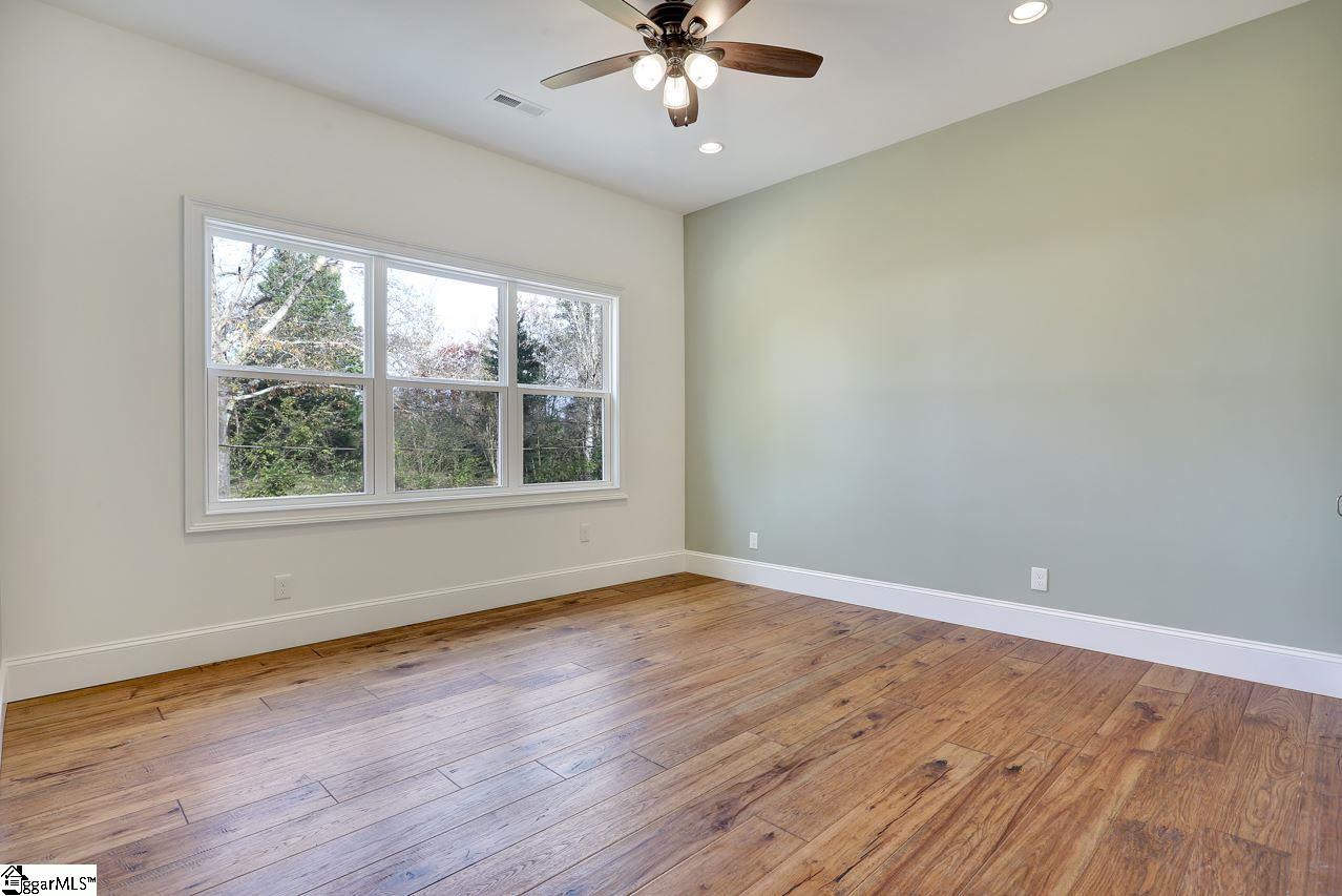 4916 State Park Road Travelers Rest, SC 29690 - Photo 29 of 34 Two large upstairs bedroom with a bathroom and work area can be used so many ways. It can serve as kids rooms with a nook for undisturbed school work. It can be a multiple generation residence or just an upstairs guest area for visitors. So many options