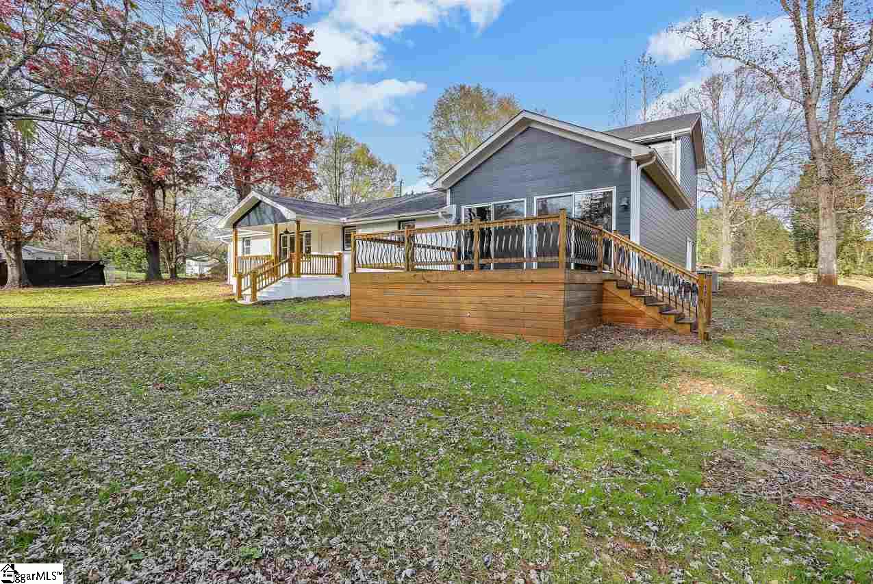 4916 State Park Road Travelers Rest, SC 29690 - Photo 4 of 34 Wonderful deck off of master bedroom, exit through large sliding doors and continue into yard or just enjoy the spacious deck