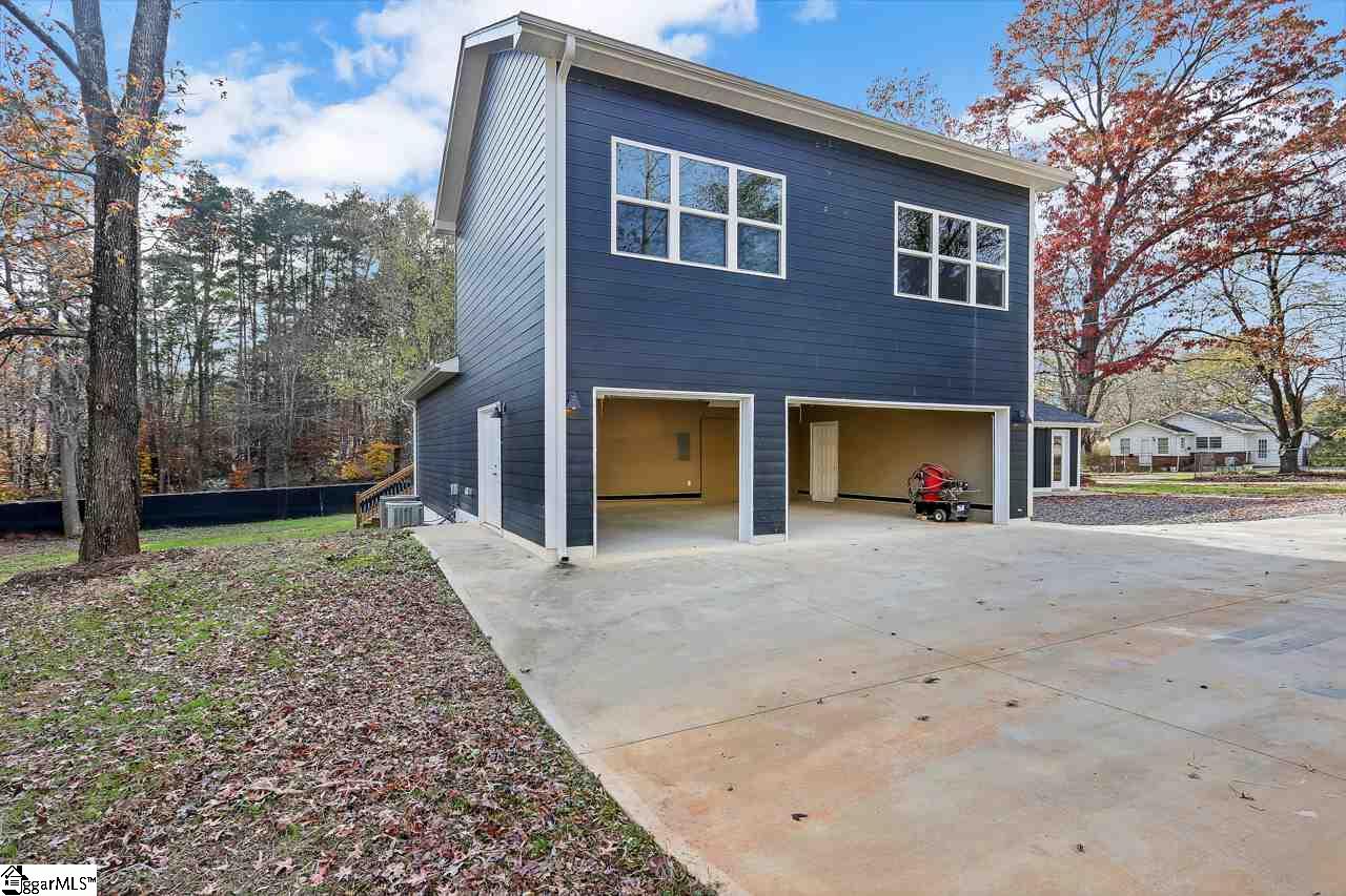 4916 State Park Road Travelers Rest, SC 29690 - Photo 6 of 34 Extra large 3 Car garage with access from either side in addition to 2 separate garage doors. Store it all here.