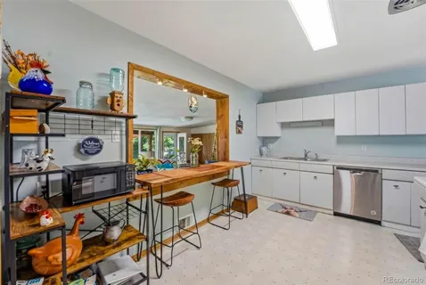 a kitchen that has a lot of cabinets in it