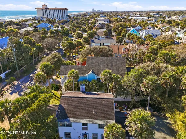 an aerial view of a house with a lake view