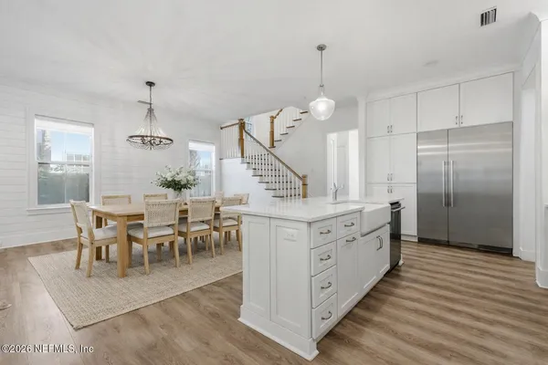 a very nice looking dining room with a wooden floor and a view of dining room