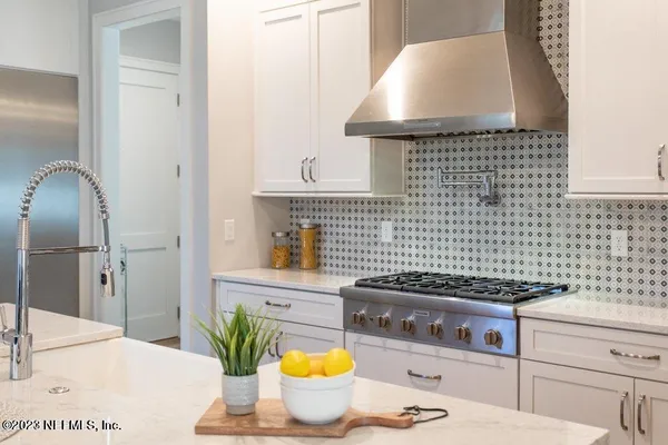 a kitchen with a stove and a cabinet