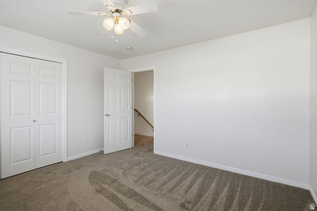 794 East 950 S Street Provo, UT 84606 - Photo 14 of 28 Neutral-toned carpeting in a room featuring a white ceiling fan with integrated lighting