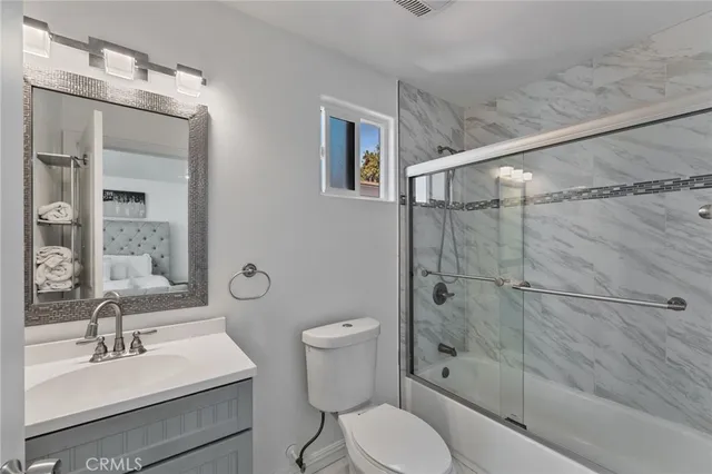 a utility room with dryer washer and closet
