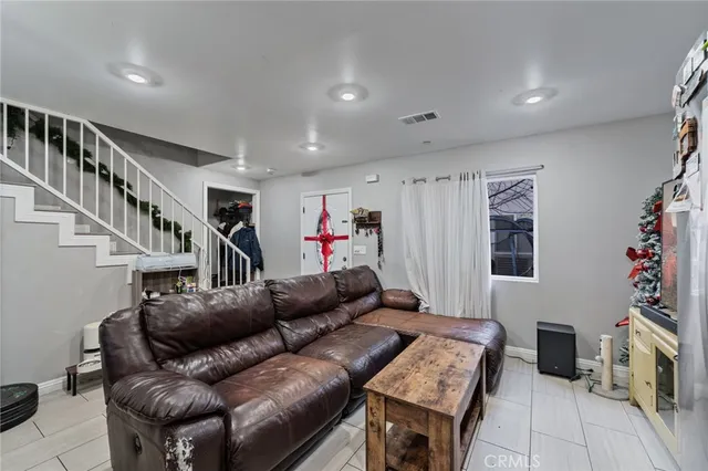 a kitchen with white cabinets and appliances