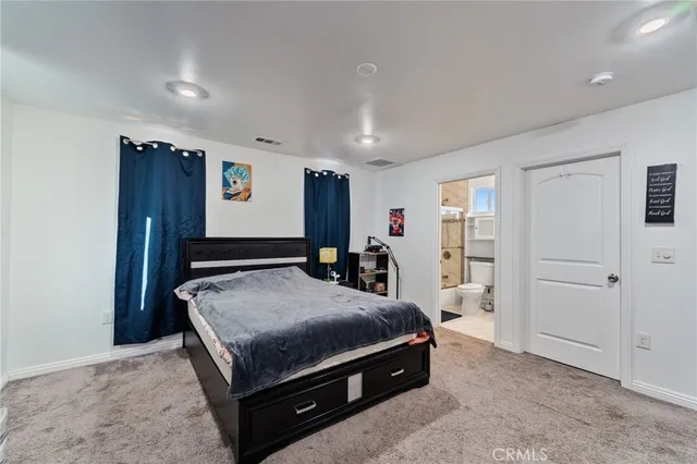 a bathroom with a sink toilet a mirror and shower