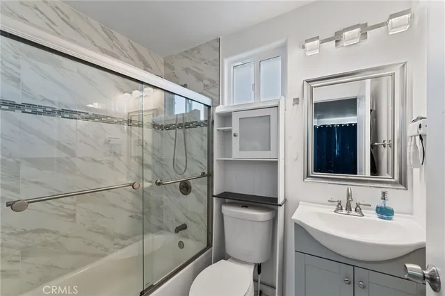 a living room with lots of furniture and a flat screen tv