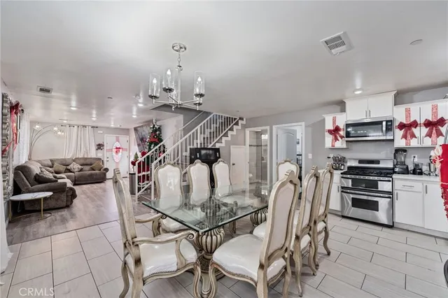 a kitchen with stainless steel appliances granite countertop a stove and a refrigerator