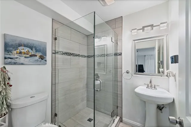 a bedroom with a bed and a cabinets