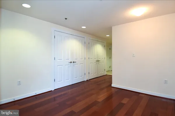 an empty room with wooden floor