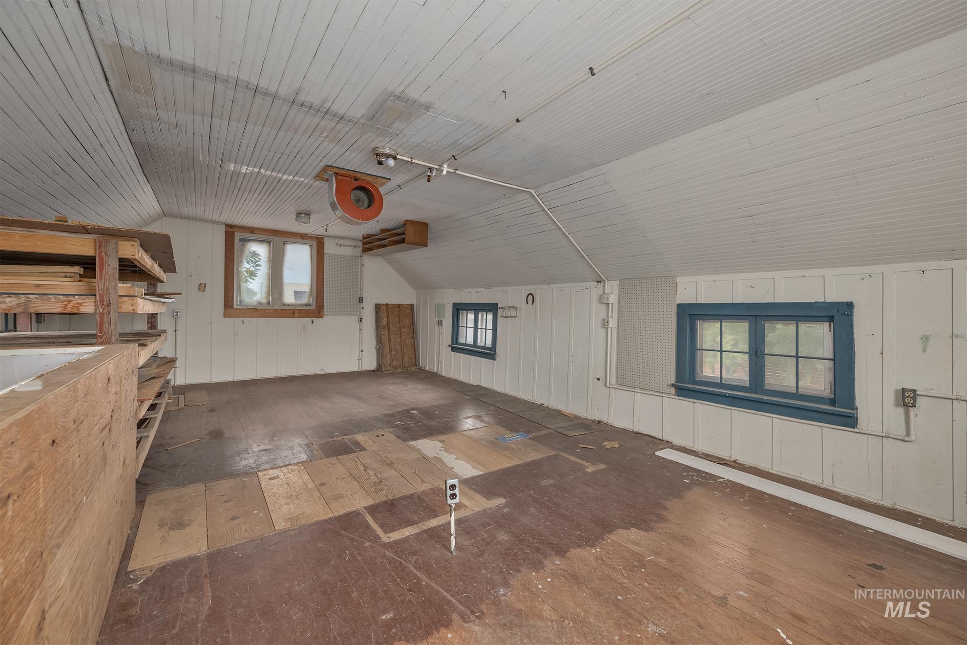 61 Southwest 4th Street Ontario, OR 97914 - Photo 41 of 42 Expansive loft space featuring wood-finish flooring and sloped ceilings