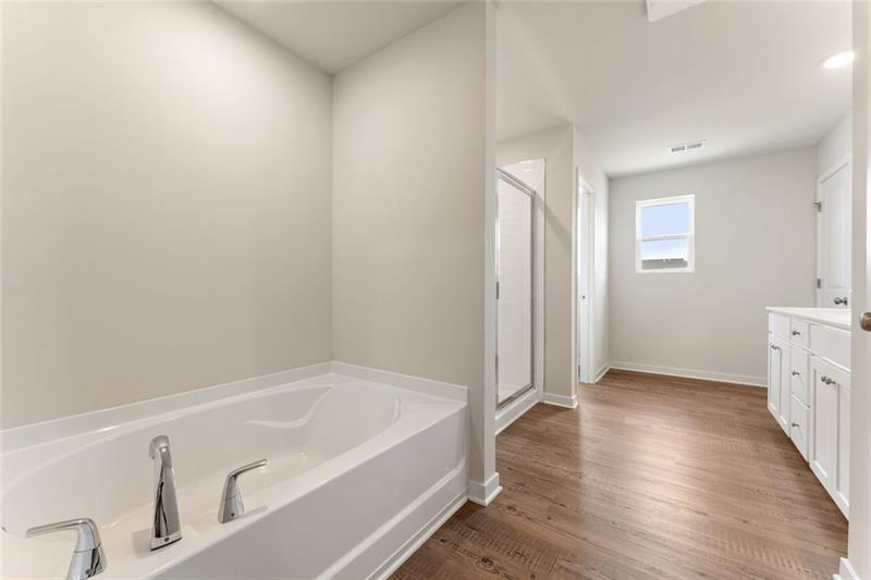 1303 Farmers Loop Austell, GA 30106 - Photo 15 of 21 a bathroom with a bathtub and a sink
