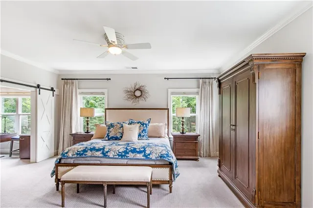 a bedroom with a bed and a television