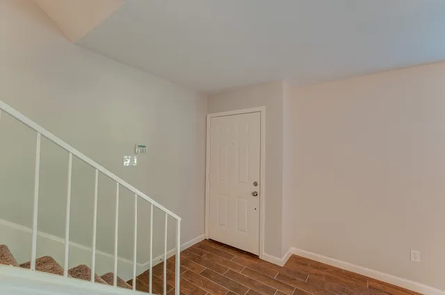 a view of entryway with wooden floor