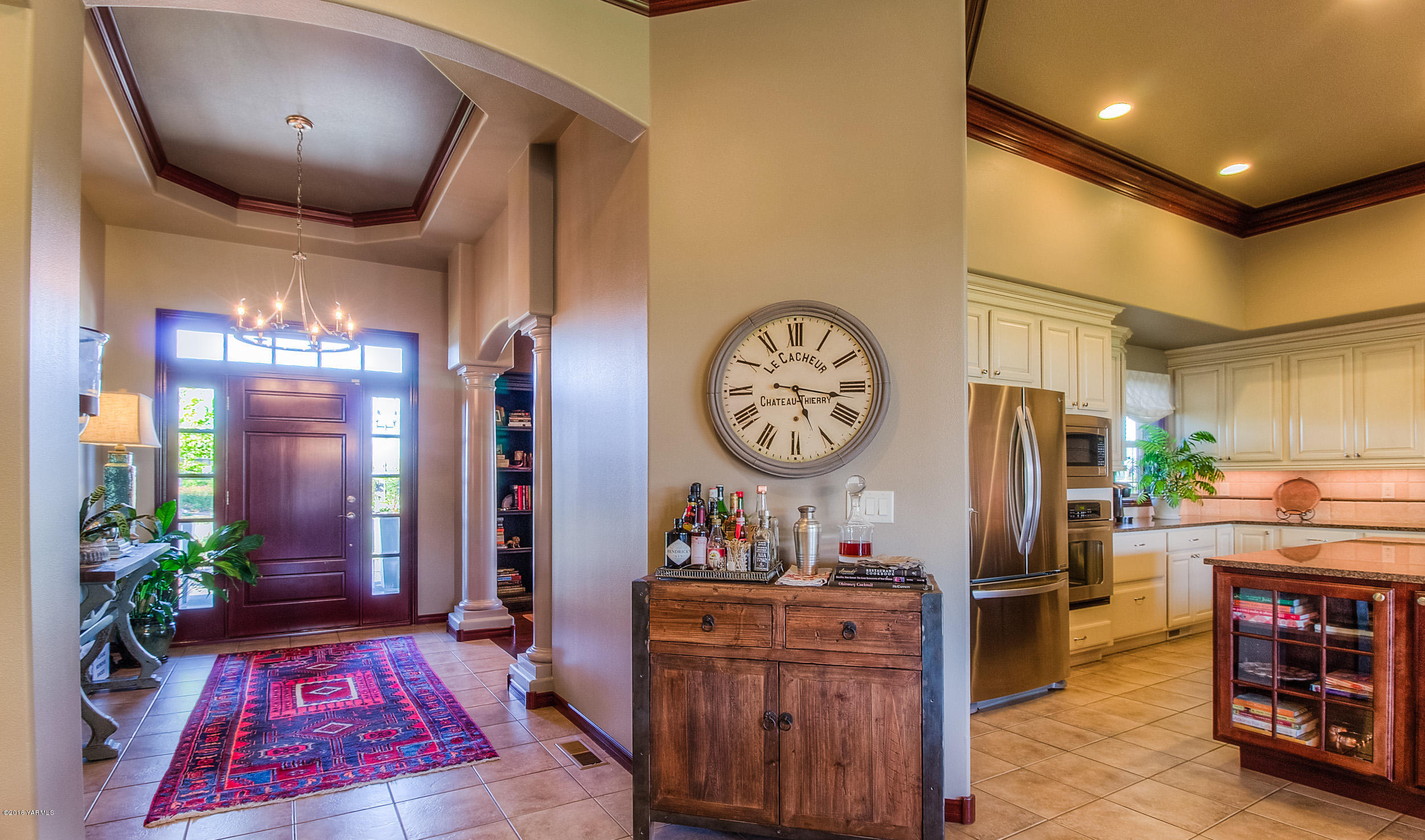 8970 Coolidge Road Yakima, WA 98903 - Photo 16 of 60 a living room with furniture and a clock