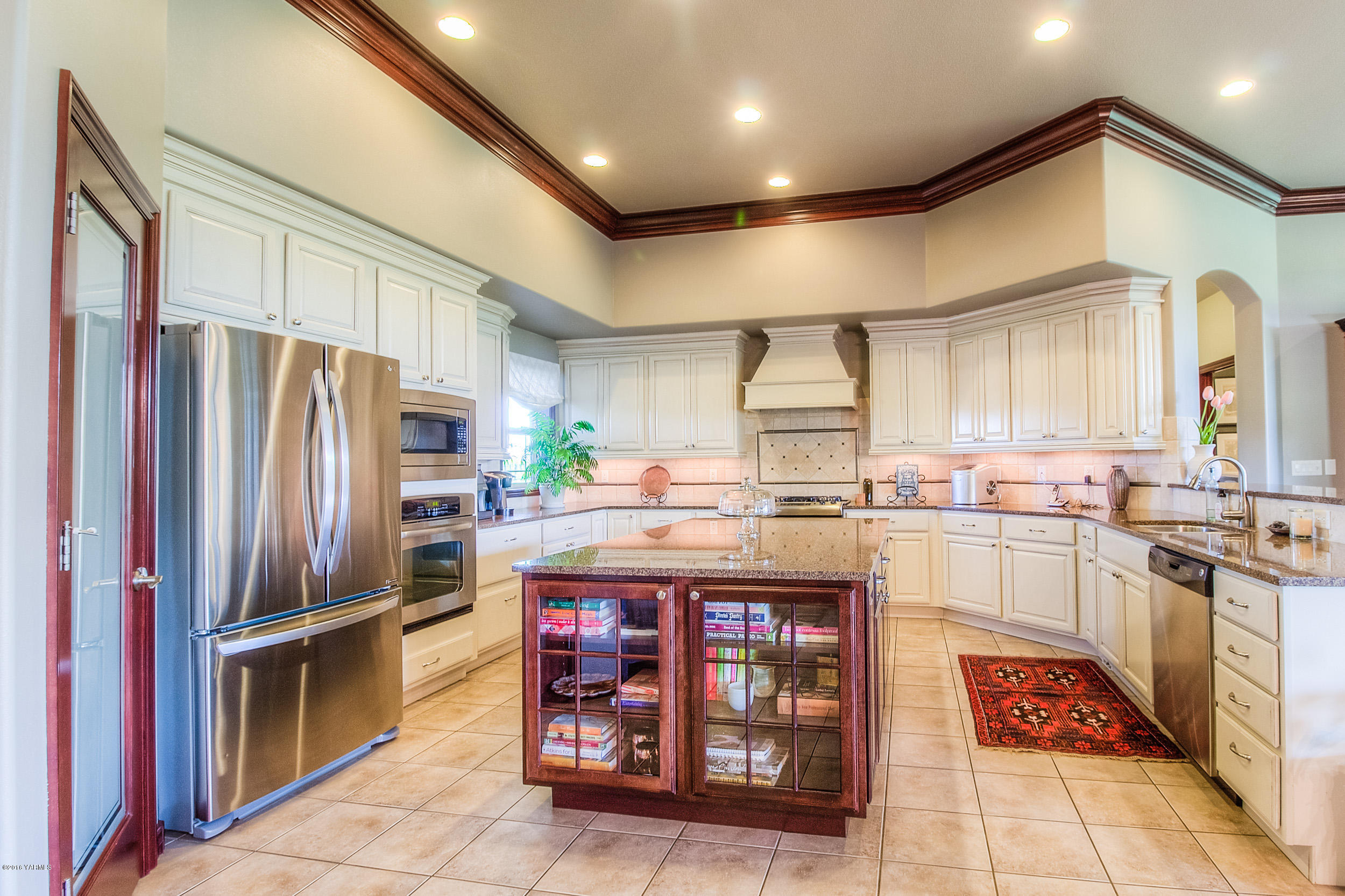 8970 Coolidge Road Yakima, WA 98903 - Photo 17 of 60 a kitchen with stainless steel appliances granite countertop a refrigerator a stove and a sink