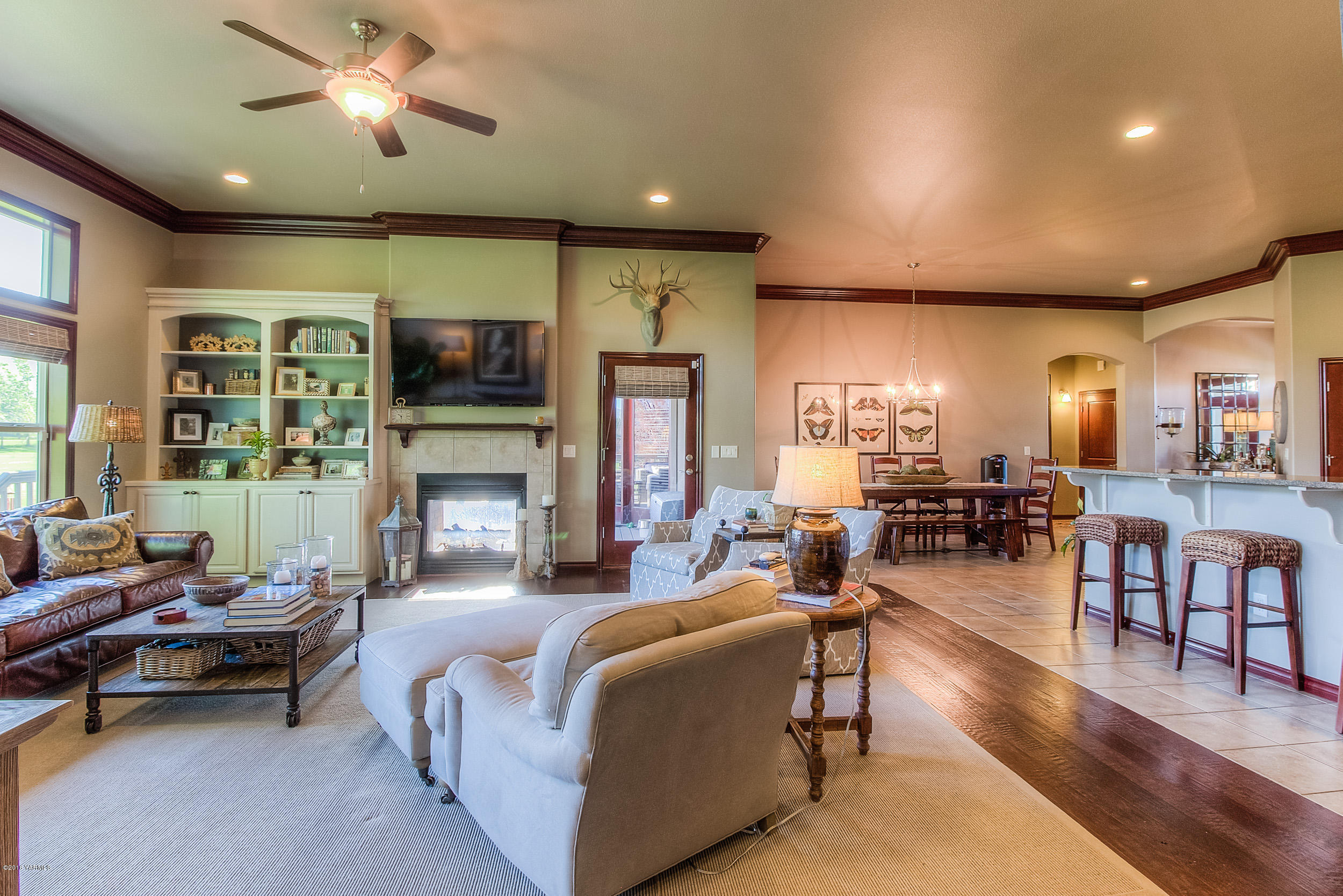 8970 Coolidge Road Yakima, WA 98903 - Photo 18 of 60 a living room with furniture and a fireplace