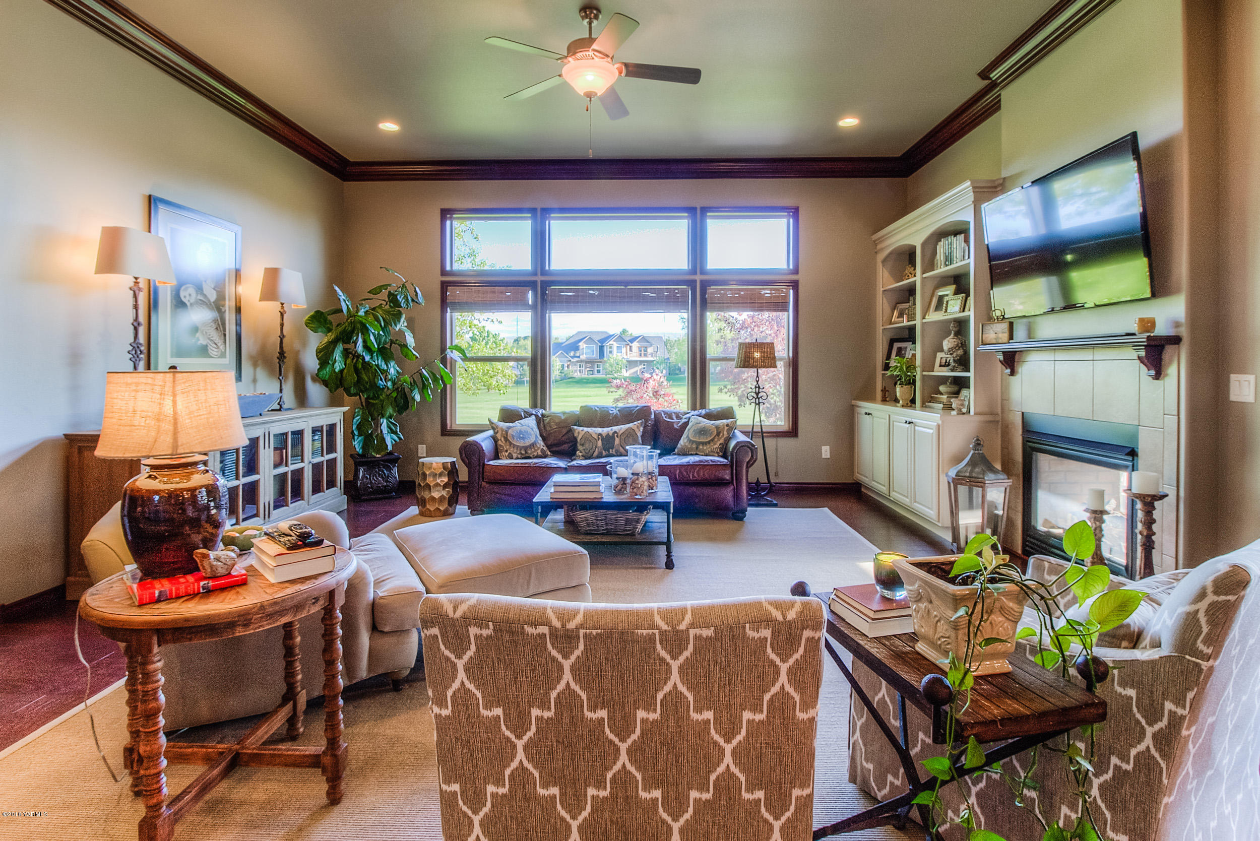 8970 Coolidge Road Yakima, WA 98903 - Photo 31 of 60 a living room with fireplace furniture and a large window