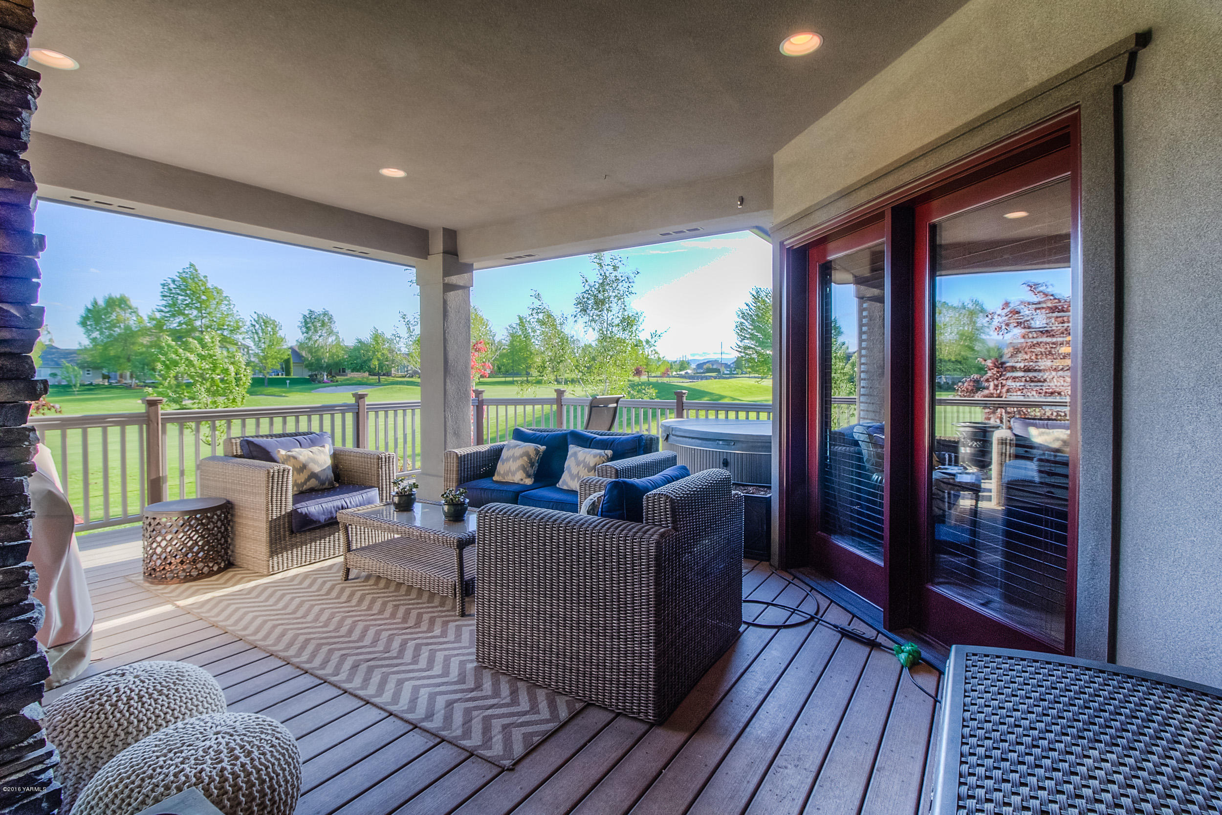8970 Coolidge Road Yakima, WA 98903 - Photo 40 of 60 a living room with furniture and a floor to ceiling window