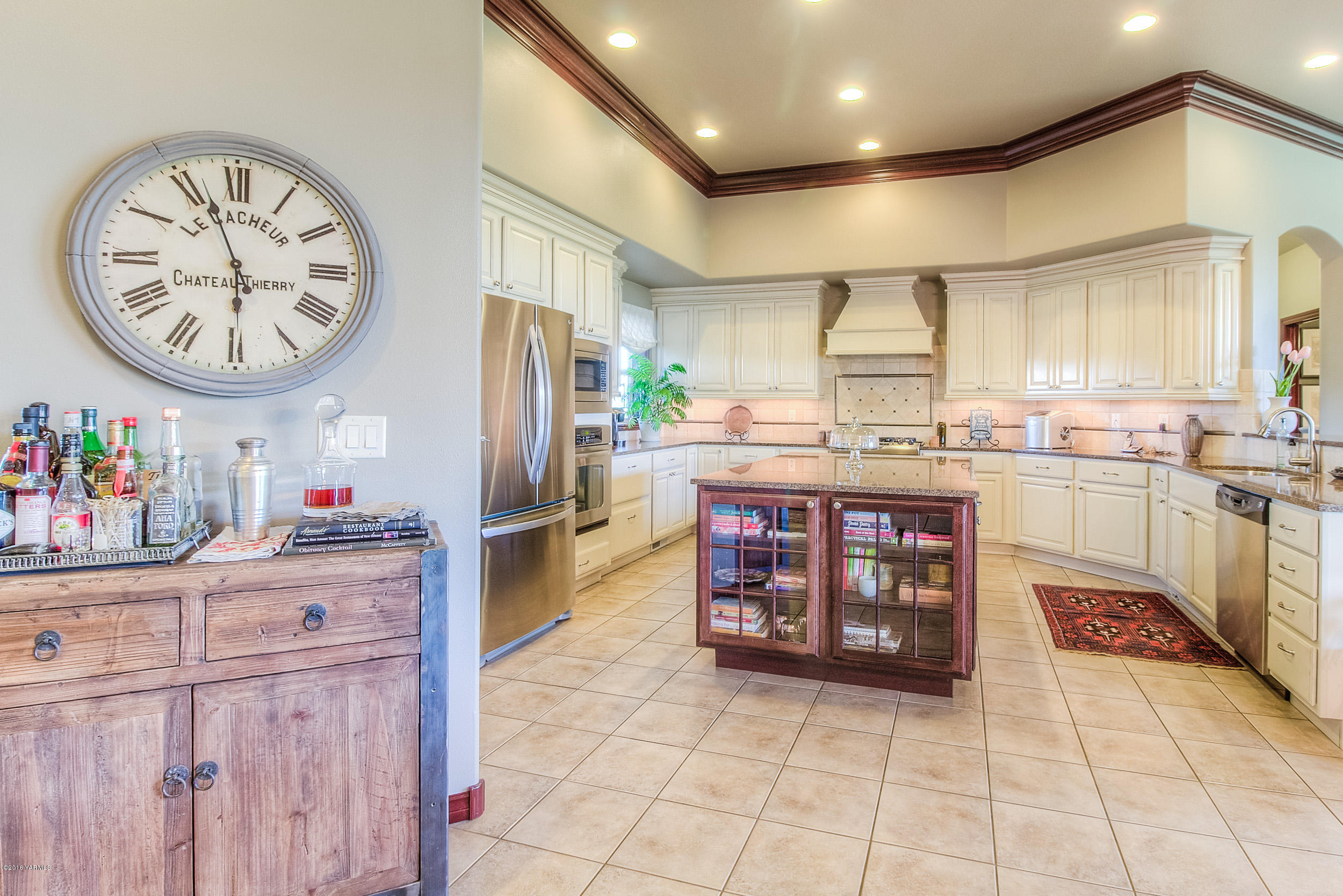 8970 Coolidge Road Yakima, WA 98903 - Photo 6 of 60 a kitchen with stainless steel appliances granite countertop a sink and cabinets