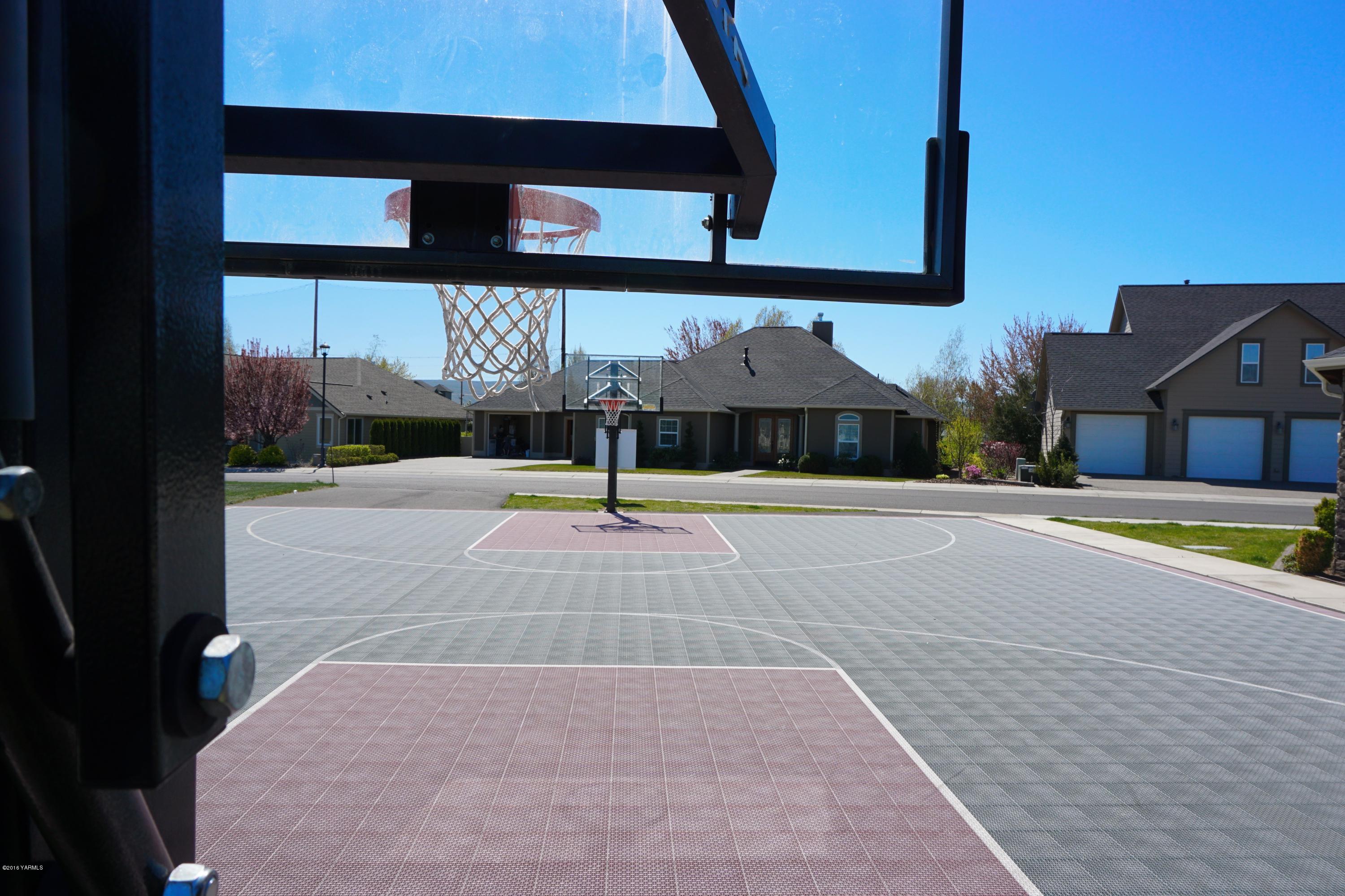8970 Coolidge Road Yakima, WA 98903 - Photo 54 of 60 a view of a swimming pool with an outdoor space and seating area