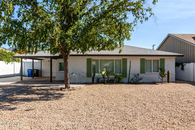 a front view of a house with a patio