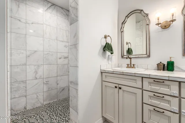 a bathroom with a sink and a mirror