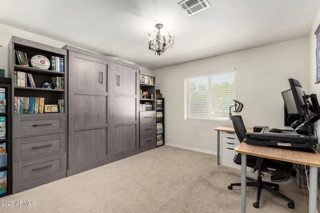 a view of a workspace with furniture