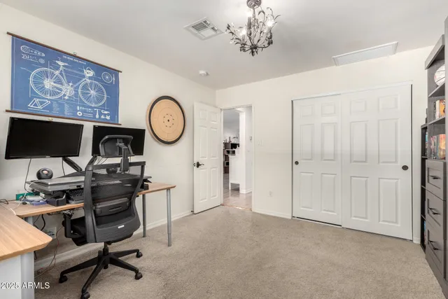a view of a workspace with furniture