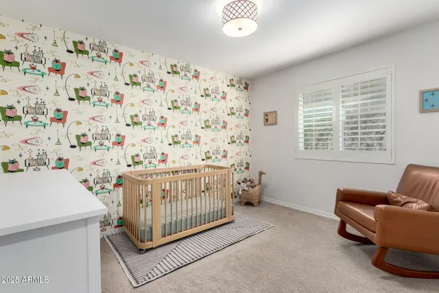 a bed room with a bed and a chair