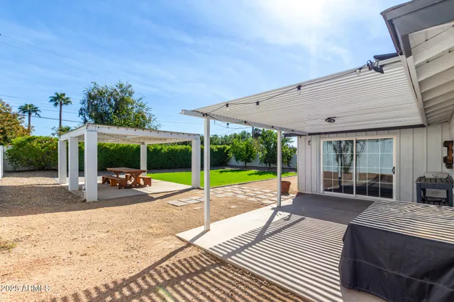 a view of a swimming pool with a patio