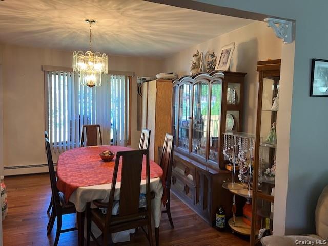 639 Townline Road Hauppauge, NY 11788 - Photo 11 of 28 a view of a dining room with furniture and chandelier