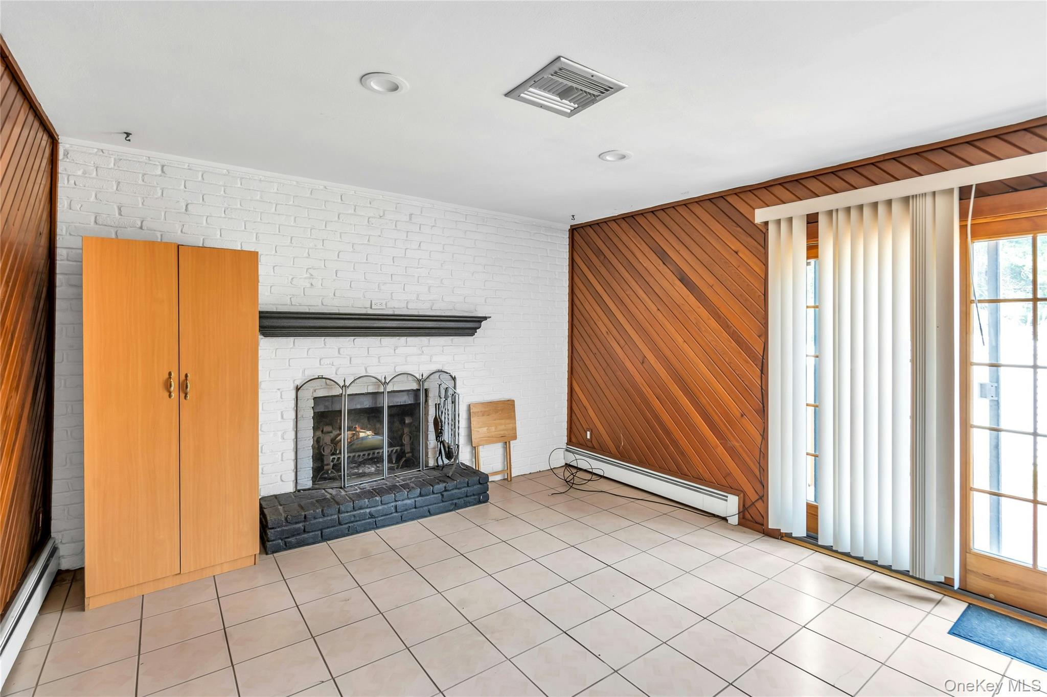 639 Townline Road Hauppauge, NY 11788 - Photo 16 of 28 a view of an empty room with window and fire place