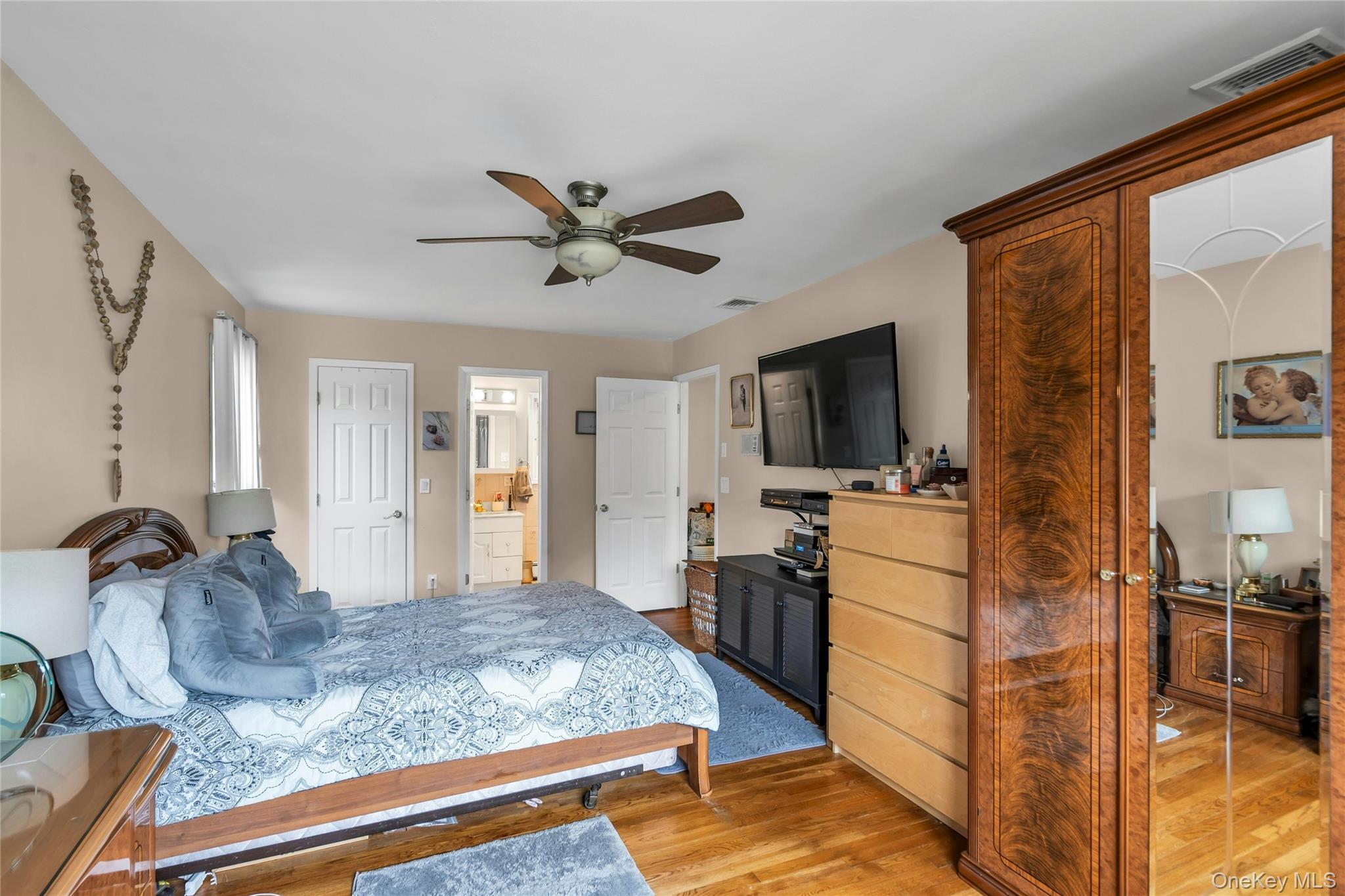 639 Townline Road Hauppauge, NY 11788 - Photo 24 of 28 a living room with furniture and a flat screen tv